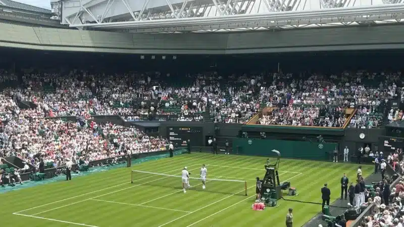 Jannik Sinner walks out on to Centre Court