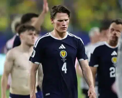 Scott McTominay walks off the pitch after defeat against Brazil.