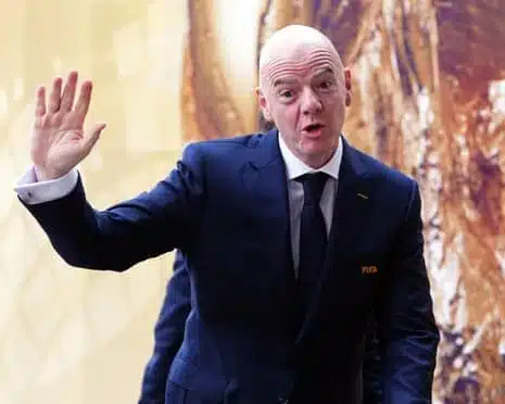 Gianni Infantino waves on the day of the World Cup final