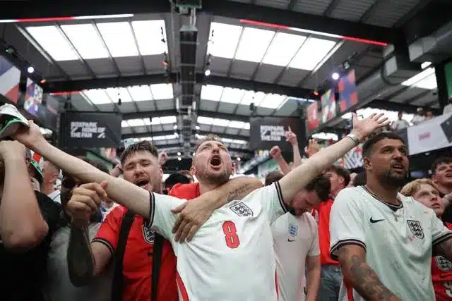 Fans watch a screening of the England match at Boxpark Wembley in London