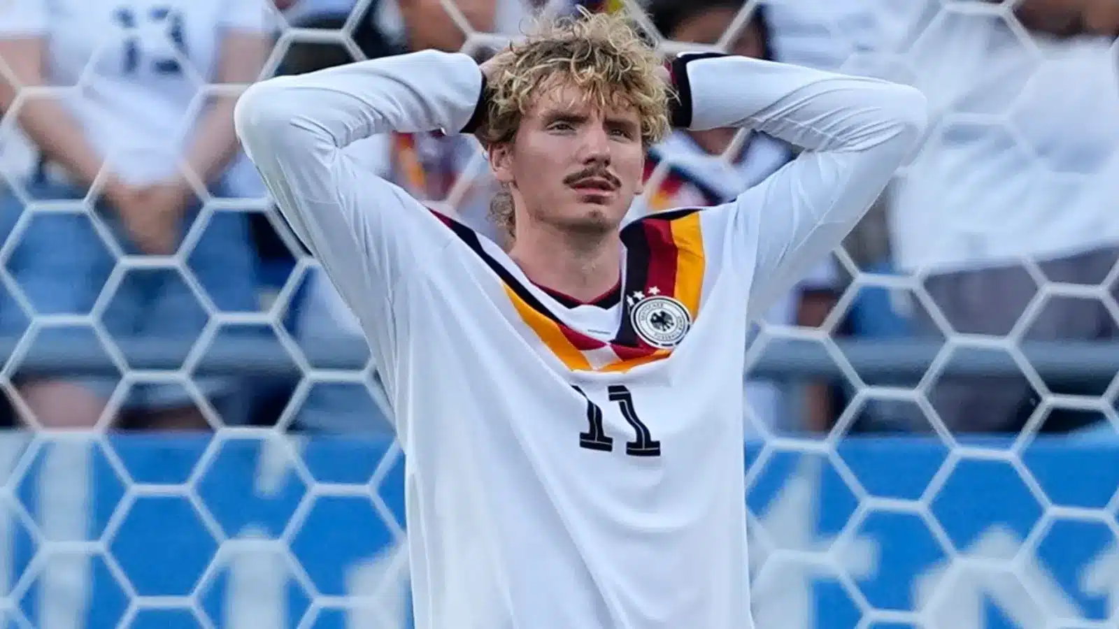 Germany's Nick Woltemade (11) reacts after failing to score during a penalty shootout at the end of during the World Cup round of 32