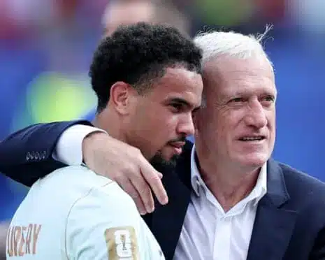 France midfielder Warren Zaïre-Emery with Didier Deschamps after the quarter-final