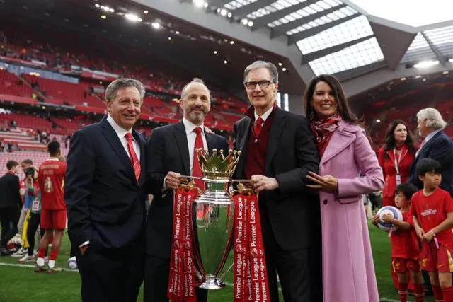 Tom Werner, Chairman of Liverpool, Michael Gordon, President of Fenway Sports Group and John Henry, Principle Owner of Liverpool and his wife Linda Pizzuti