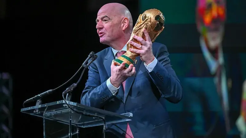 FIFA president Gianni Infantino holds the FIFA World Cup trophy