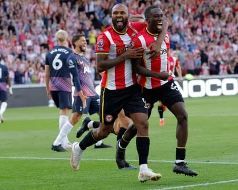 Michael Kayode (right) celebrates scoring Brentford’s third goal against Spurs with Igor Thiago.