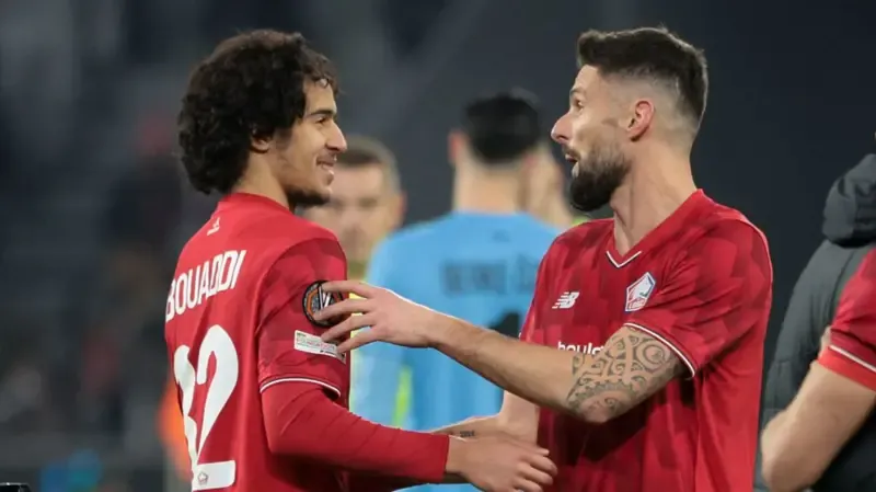 Olivier Giroud and Ayyoub Bouaddi interact